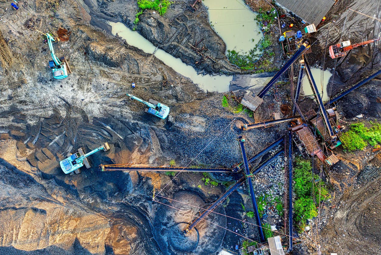Aerial image of an active construction site in Banten, showcasing machinery and excavators.